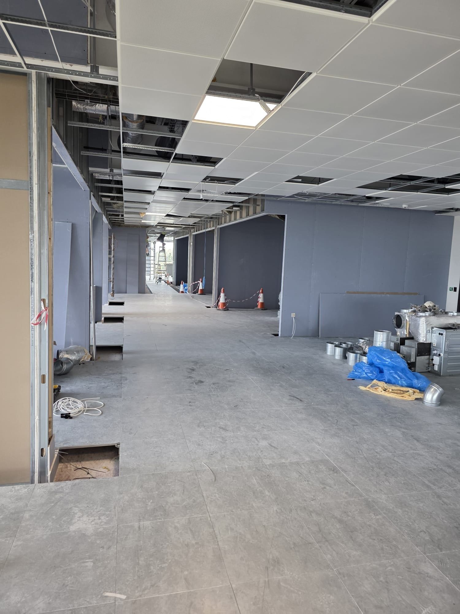 A long office corridor with new partition walls on both sides